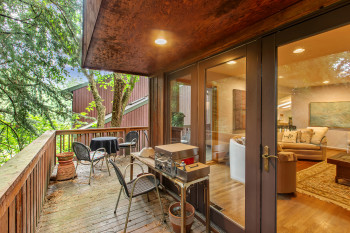 Wooden terrace featuring grilling area