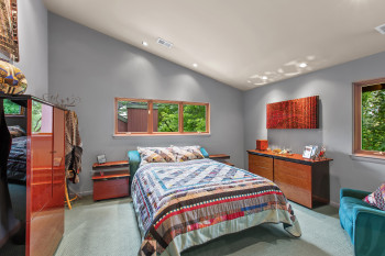 Bedroom featuring vaulted ceiling, recessed lighting, and carpet flooring