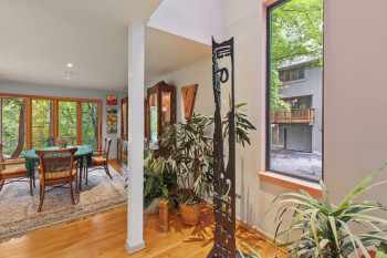 Dining space with wood finished floors and recessed lighting