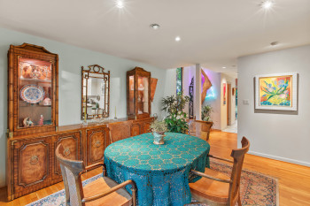 Dining area featuring light wood-type flooring, wet bar, and recessed lighting