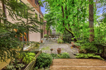 View of yard with a patio and a wooden deck