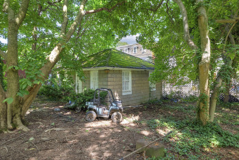 View of property exterior featuring a shingled roof