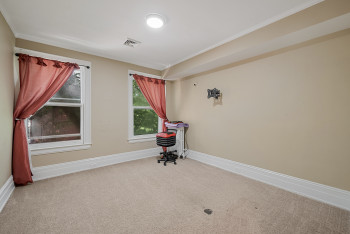 Unfurnished room featuring carpet and ornamental molding