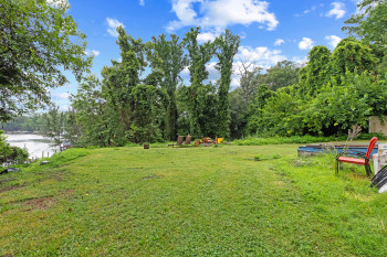 View of grassy yard featuring a water view