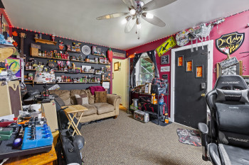 Playroom with carpet flooring and ceiling fan