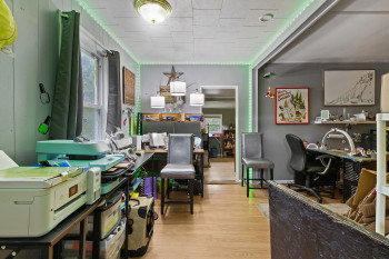 Home office featuring wood finished floors