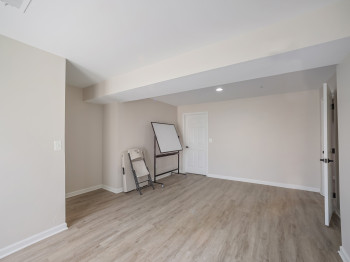 Unfurnished room with light wood-type flooring and recessed lighting