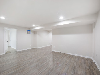 Finished below grade area with recessed lighting and wood finished floors