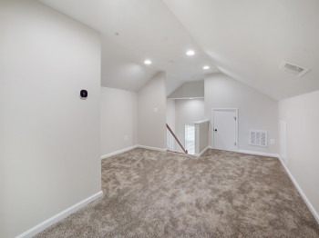 Bonus room with vaulted ceiling, carpet floors, and recessed lighting