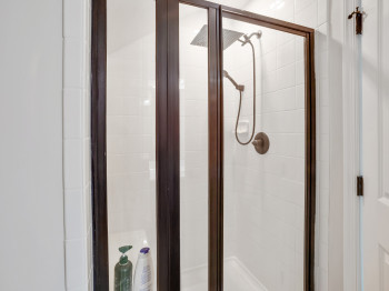 Full bath with a shower stall