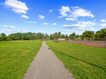 Surrounding community with a tennis court