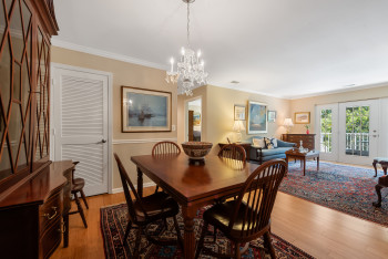 Dining room featuring crown molding, light wood finished floors, and a chandelier