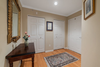 Entrance foyer featuring light wood-type flooring and ornamental molding