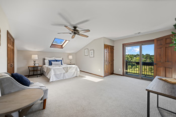 Primary Suite with Balcony overlooking the pond