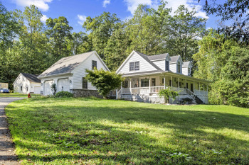 Wrap-around porch and attached 2-car garage