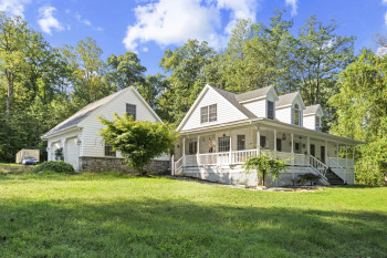 Wrap-around porch and attached 2-car garage