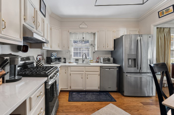Updated roomy kitchen with quartz tops