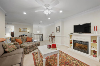 Loft living area features a fireplace for those chilly days, evenings