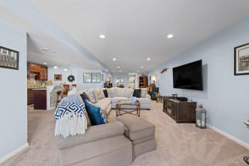 No expense spared in the design of this level of the home including this beautiful wet bar area with granite counters and seating