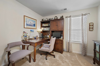 Upper level bedroom 3 currently set up as wonderful Office area featuring light colored carpet