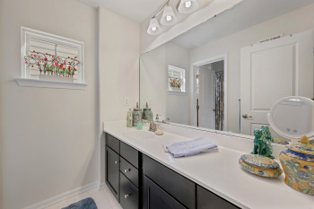 Upper level large full Bathroom featuring vanity, light tile patterned floors, and  shower