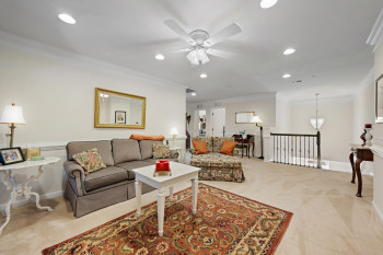 Alternate view of loft living area with carpet flooring, crown molding, recessed lighting, and ceiling fan