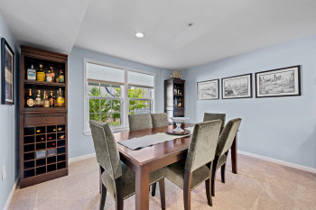 There is even Dining space featuring light carpet. Entire lower level is light filled, rare in the lower level of homes.
