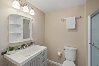 Full bathroom with vanity and ceramic tile