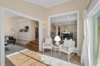 Cozy sitting area two steps from dining