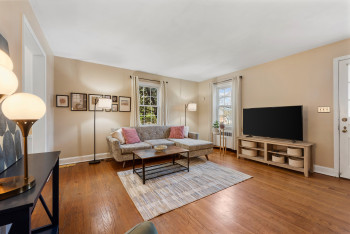 Spacious Living Room with original hardwood floors