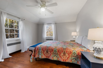 Sunny corner primary bedroom