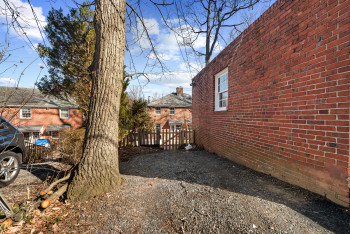Parking Pad adjacent to garage. Easy access through wide alley.