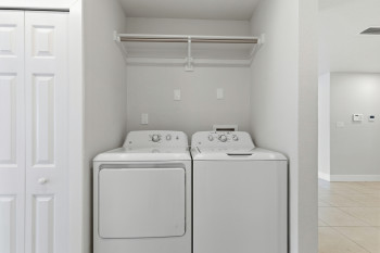 Laundry area with washer and clothes dryer