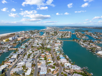 Aerial perspective of suburban area featuring the Gulf and Intracoastal Waterways.