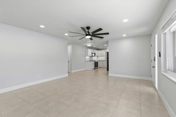 Unfurnished living room featuring recessed lighting, ceiling fan, and light tile patterned floors
