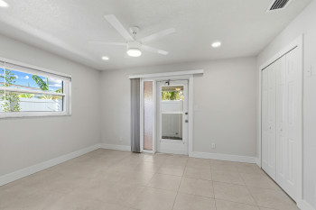 Bedroom #2 featuring ceiling fan, access to exterior covered porch, recessed lighting, a closet, and light tile patterned flooring