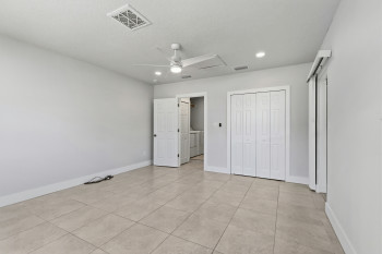 Bedroom #3 or Office/Living Space with ceiling fan, light tile patterned floors, a textured ceiling, and recessed lighting, private entry door.