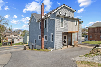 View of home's exterior featuring a chimney