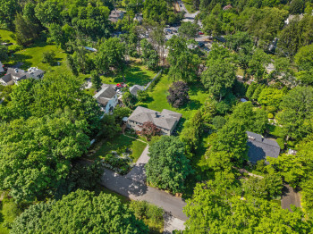 Aerial perspective of 504 Glenwood surrounded by mature trees