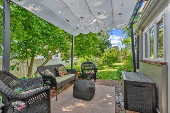 Covered brick patio is directly off the Kitchen