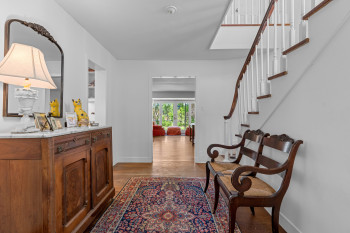 Foyer with curved staircase to the second floor