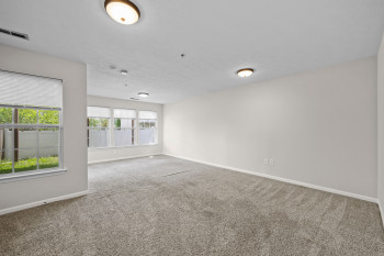 Large family room on entry level with tons of natural light, slider to the back yard, storage and laundry