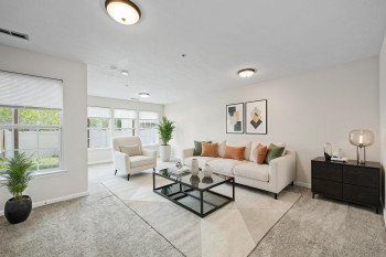 Large family room on entry level with tons of natural light, slider to the back yard, storage and laundry