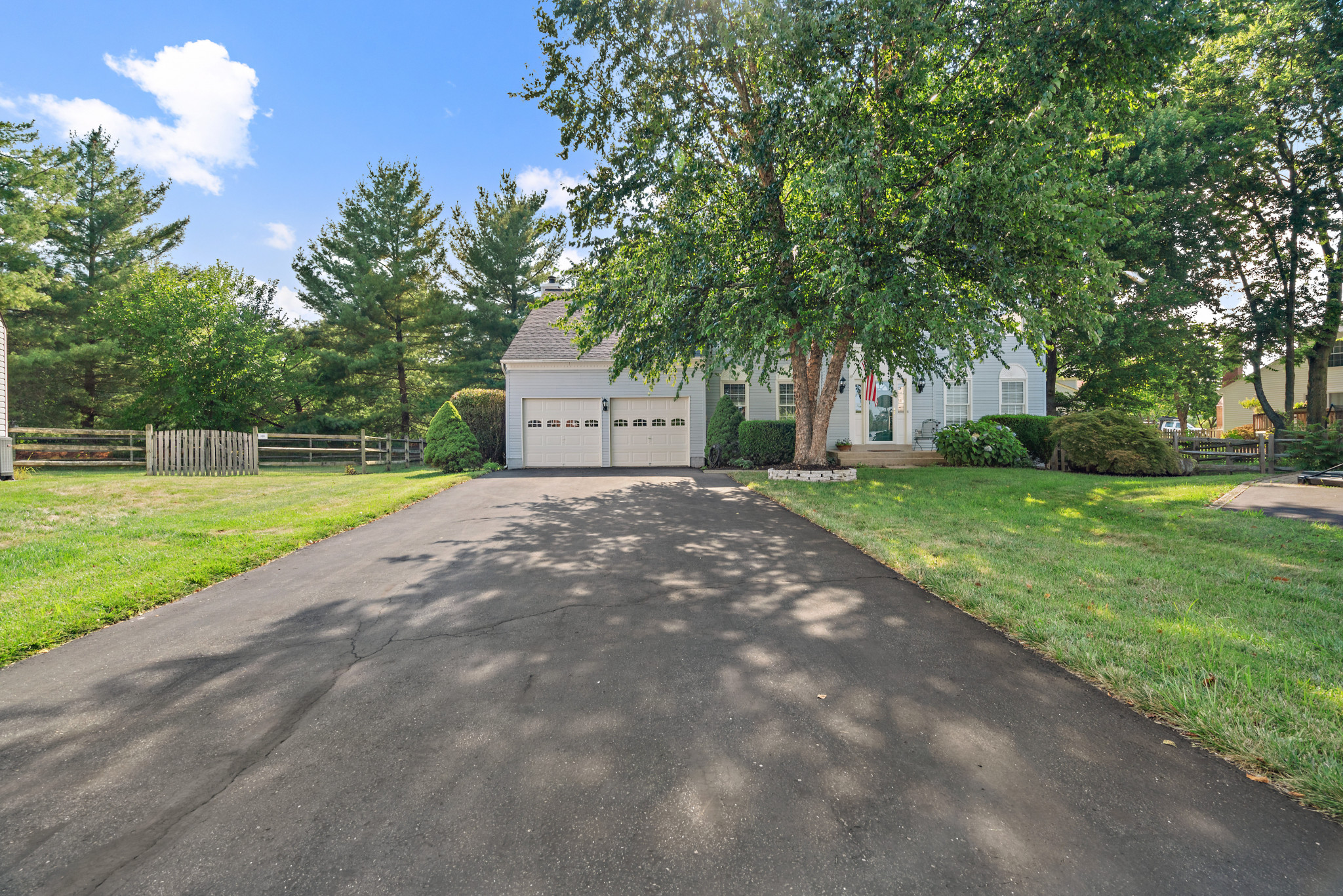 Obstructed view of property featuring a front lawn