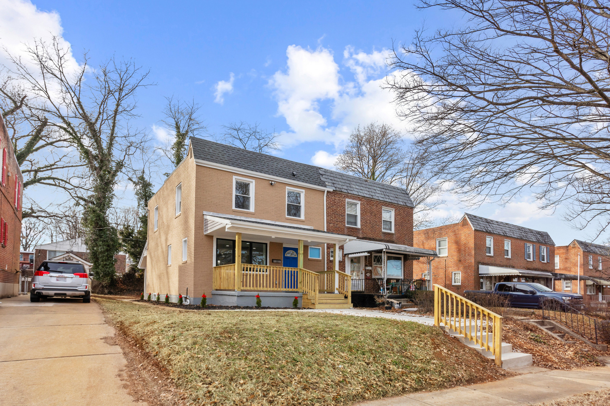 View of front of property with a front lawn and covered porch
