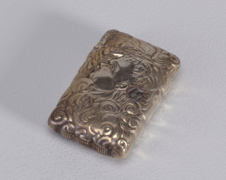 Matchsafe Hand Holding Cigar Amid Smoke and Man Blowing Smoke Matchsafe