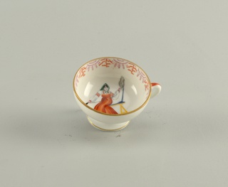 Woman Spinning Cup And Saucer