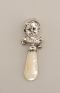 Baby Rattle with Bust of a Baby in a Nightcap Baby Rattle