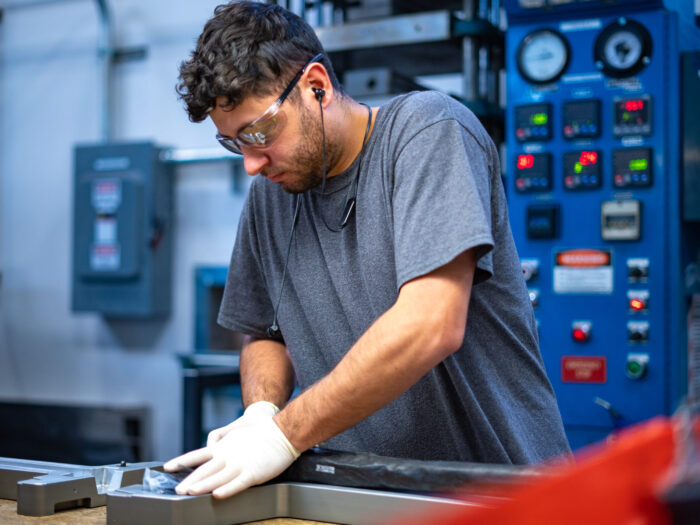 Intensive hand labor during carbon fiber bicycle frame manufacturing