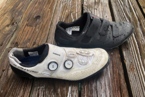 Shimano S-Phyre XC902 & XC1 Shoes displayed on woodboard after a comparison test